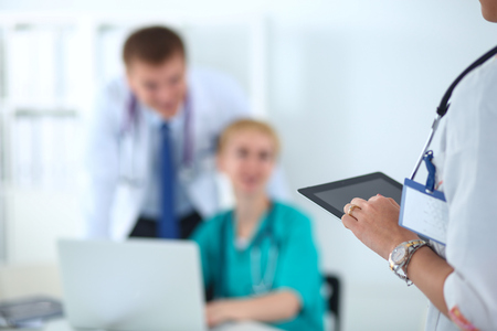 Woman doctor standing with stethoscope at hospital .の写真素材