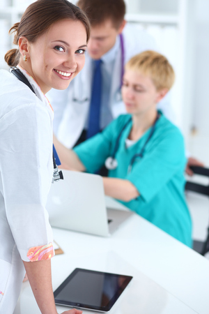 Woman doctor standing with stethoscope at hospital .の写真素材
