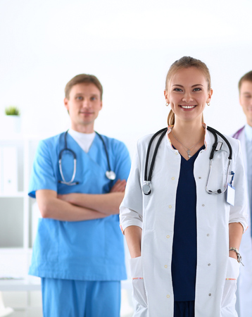 Attractive female doctor in front of medical group .の写真素材