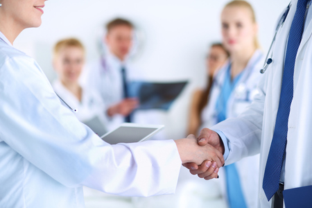 Young medical people handshaking at office .の写真素材