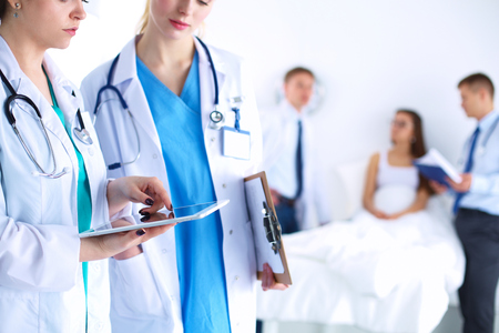 Young woman  doctor holding a tablet pc .の写真素材