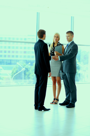 Businesswoman Shaking Hands In Officeの写真素材