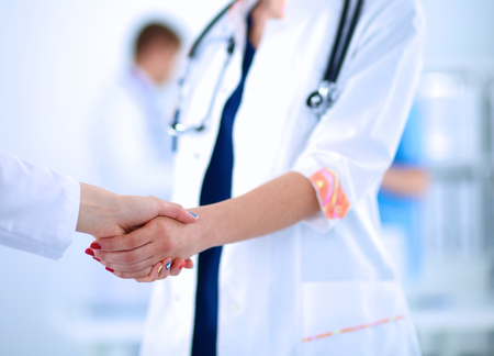 Young medical people handshaking at office .の写真素材