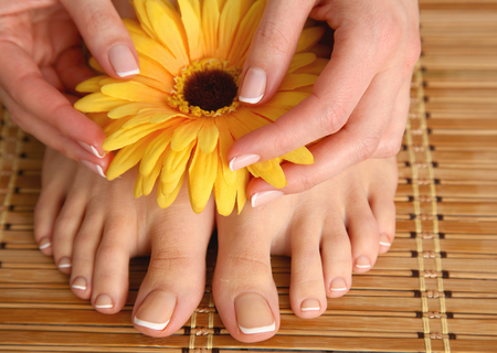 Care for beautiful woman legs with flower .の写真素材
