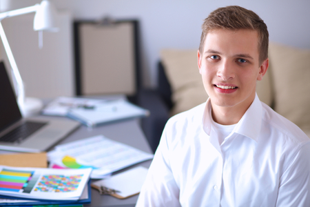 Portrait of a handsome office worker in the officeの写真素材