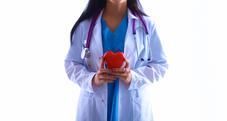 A doctor holding a heart in her handsの写真素材
