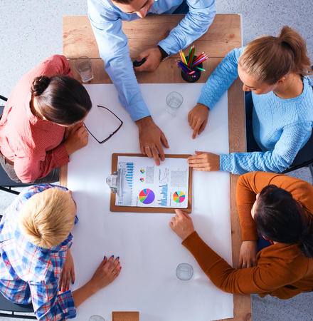 Business people sitting and discussing at business meeting, in office.の写真素材