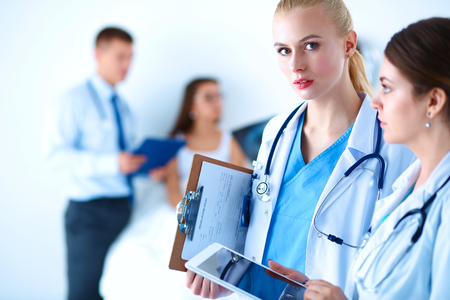 Young woman  doctor holding a tablet pc .の写真素材