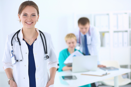 Woman doctor standing with stethoscope at hospital .の写真素材