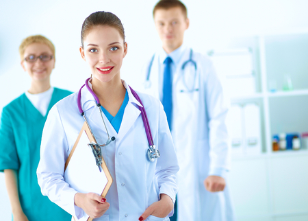 Attractive female doctor in front of medical group .の写真素材