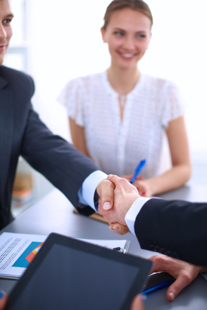 Business people shaking hands, finishing up a meetingの写真素材