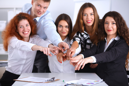 Business people group team point finger at you, in officeの写真素材
