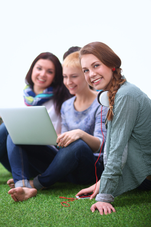 Group of young student using laptop together .の写真素材