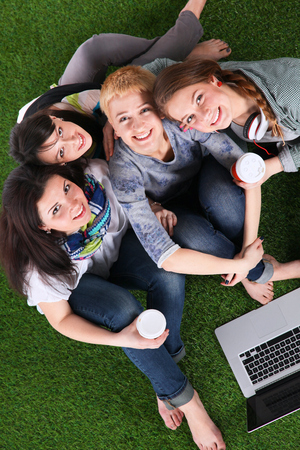 Group of young student using laptop together .の写真素材