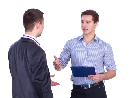 Portrait of young men standing with folder, isolated on white backgroundの写真素材