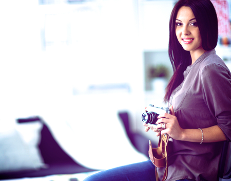 Woman is a proffessional photographer with camera.の写真素材