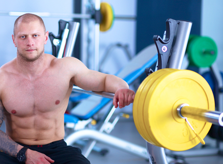 Young handsome man after workout in the gym .の写真素材