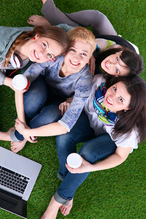 Group of young student using laptop together .の写真素材