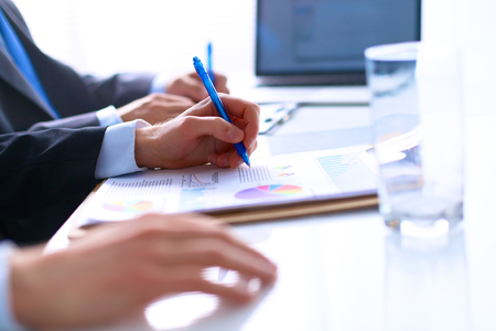 Business people sitting and discussing at business meeting, in office.の写真素材