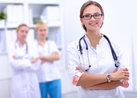 Portrait of woman doctor standing at hospitalの写真素材