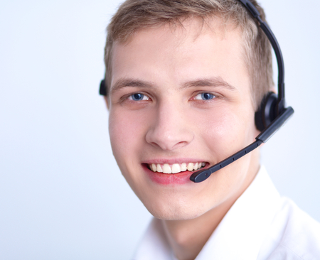 Call center male operator on gray backgroundの写真素材