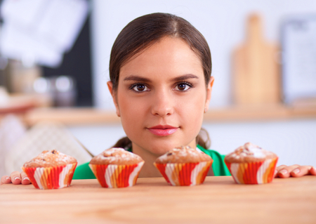 Woman is making cakes in the kitchen, isolatedの写真素材