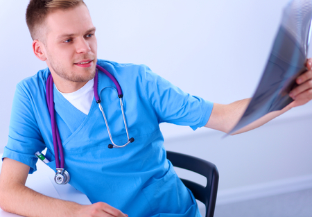 Portrait of a male doctor with x-ray picture of spineの写真素材