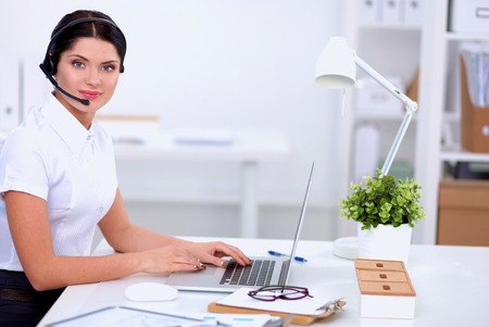 portrait of a customer service agent sitting at officeの写真素材