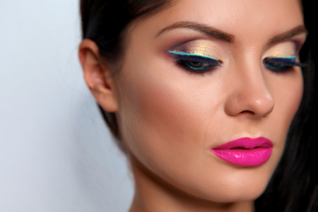 Beautiful Girl Face.Perfect Makeup.Professional Make-up.isolated on whiteの写真素材