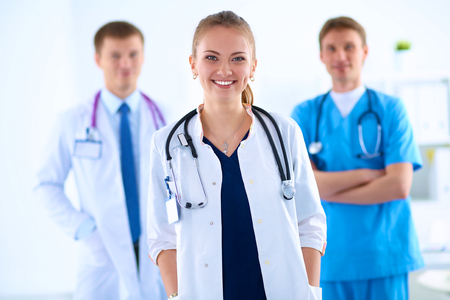 Attractive female doctor in front of medical group .の写真素材