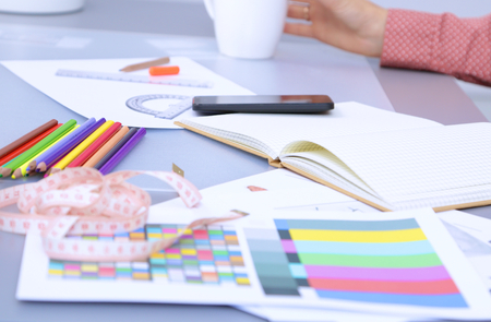 Modern young fashion designer working at studio.isolatedの写真素材