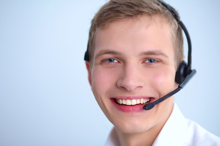 Call center male operator on gray backgroundの写真素材