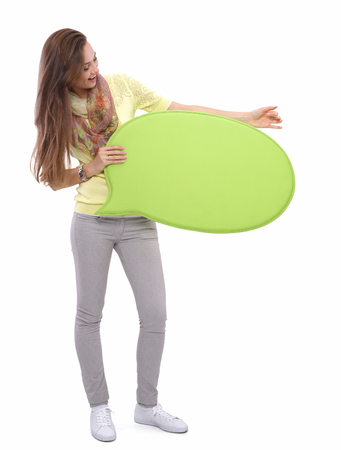 Portrait of a casual young woman holding blank cardの写真素材