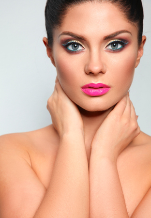Portrait of beautiful woman, on grey background.の写真素材