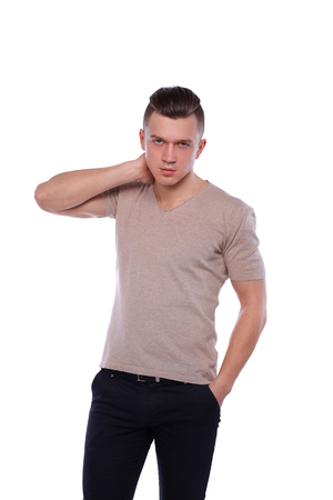 Portrait of a confident man standing over white background.の写真素材