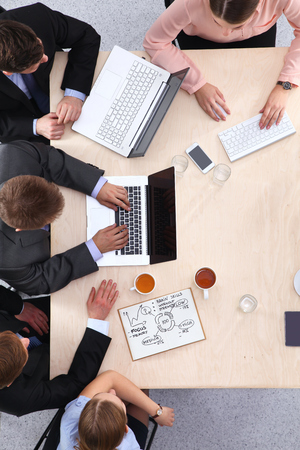 Business people sitting and discussing at business meeting, in office.の写真素材