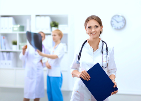 Portrait of woman doctor standing at hospitalの写真素材