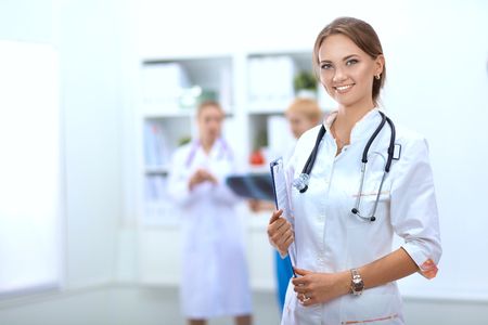 Portrait of woman doctor standing at hospitalの写真素材