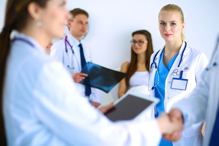 Young medical people handshaking at officeの写真素材