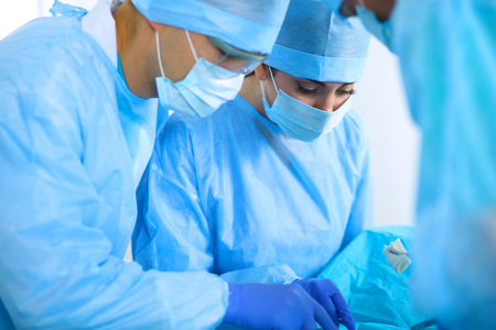 Young surgery team in the operating roomの写真素材