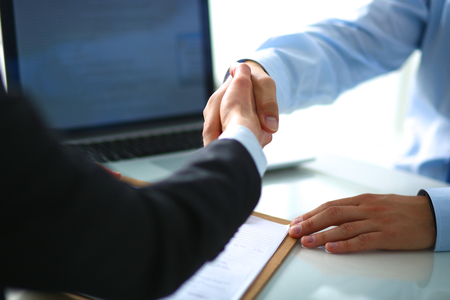 Business people shaking hands, finishing up a meetingの写真素材