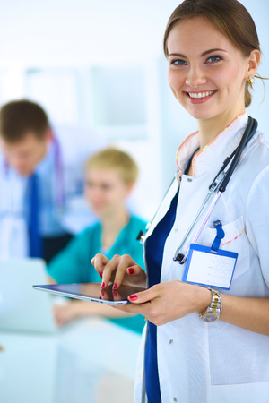Portrait of woman doctor standing at hospitalの写真素材