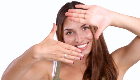 Young attractive woman framing her hands .の写真素材