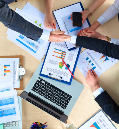 Business people sitting and discussing at business meeting, in office.の写真素材