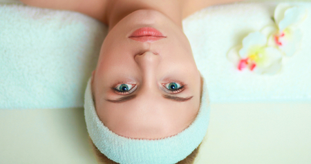 Young woman getting spa massage, lying on spa salonの写真素材