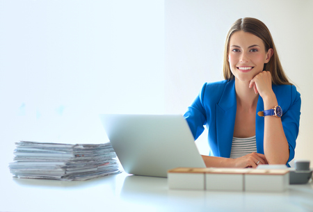 Woman with documents sitting on the deskの写真素材