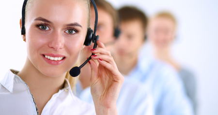 Attractive positive young businesspeople and colleagues in a call center office.の写真素材