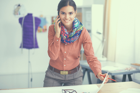 Modern young fashion designer working at studio.の写真素材