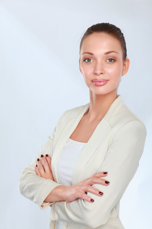 Young woman standing on white backgroundの写真素材