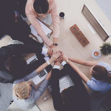 Business team with hands together - teamwork concepts